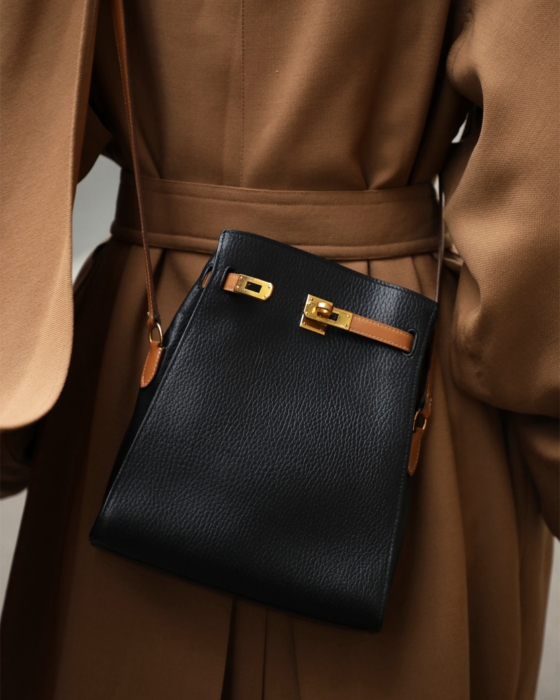 Black and Gold Kelly Sport Bag Hermès Vintage, Model, chosen by Semaine Tastemaker Charlotte Chesnais.