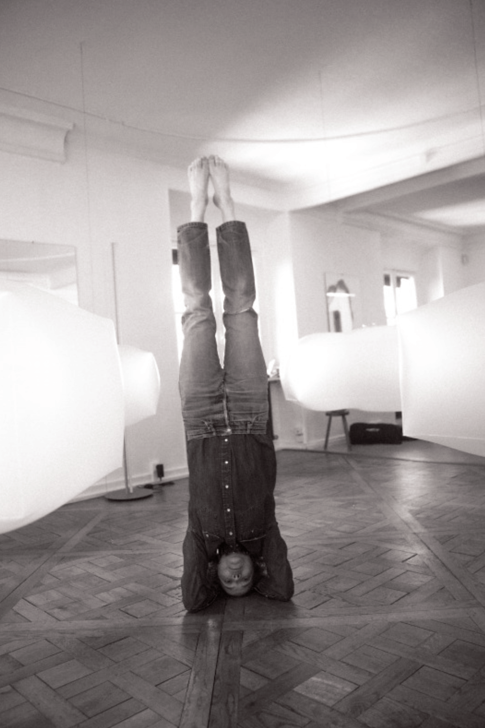 Charlotte doing yoga in her studio